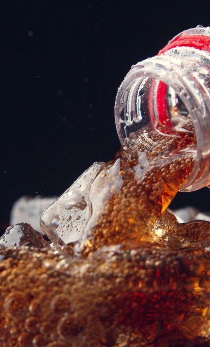serving-cola-from-bottle-glass-full-ice-fotor-2023082253414